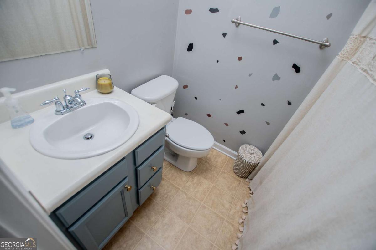1074 Glenloch Road Roopville, GA 30170 - Photo 47 of 98 a bathroom with a sink and a toilet