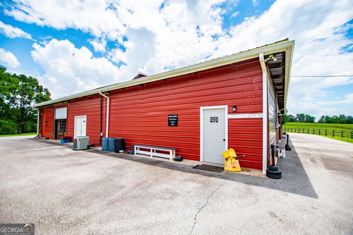 1074 Glenloch Road Roopville, GA 30170 - Photo 58 of 98 a view of a house with a yard