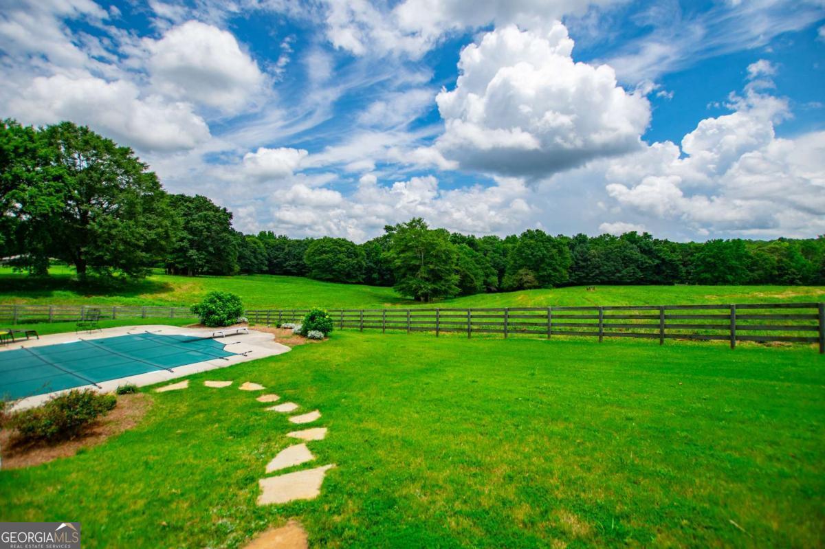 1074 Glenloch Road Roopville, GA 30170 - Photo 6 of 98 a view of a golf course with a lake