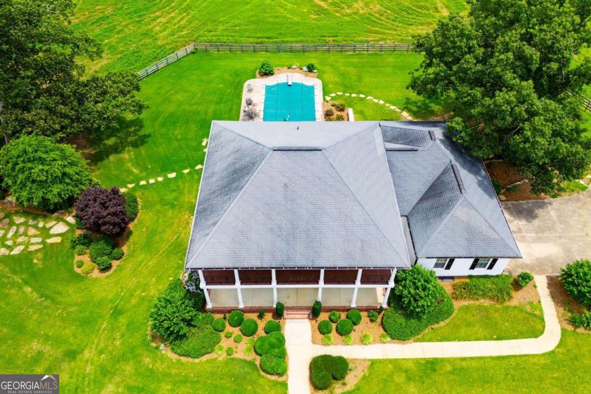 1074 Glenloch Road Roopville, GA 30170 - Photo 77 of 98 an aerial view of a house with a yard and lake view