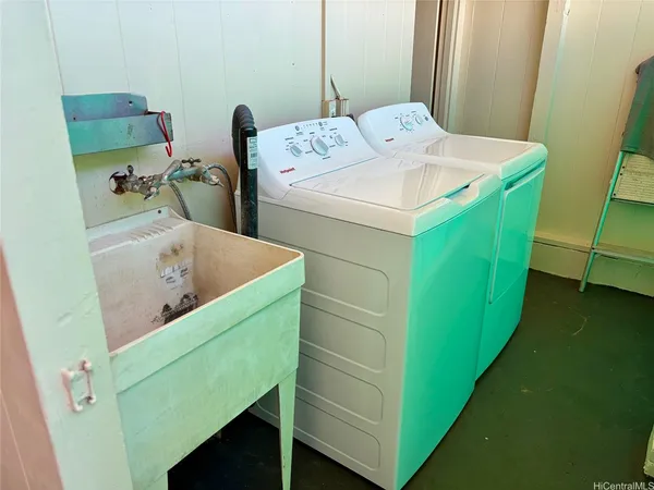 a utility room with dryer and washer