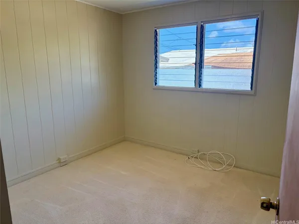 a view of a room that has a window in it