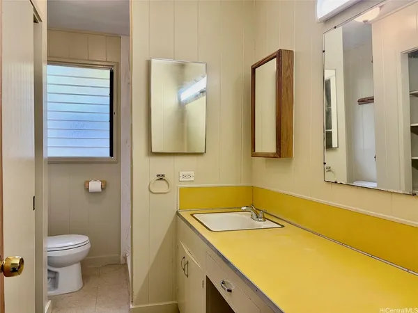 a bathroom with a sink and a toilet