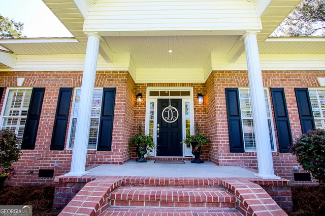 a kitchen with lots of counter top space and dining table