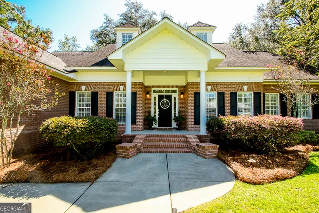 a front view of a house with swimming pool