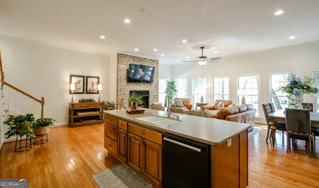 a bedroom with a bed and a lamp on dresser