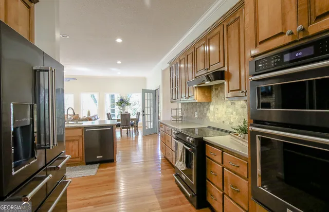 a bed room with a bed window and a television