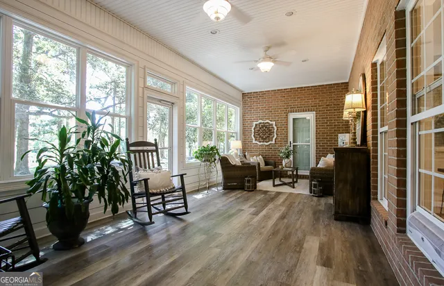 a bathroom with a toilet and a mirror