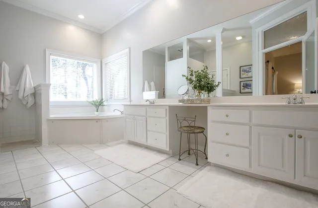 a view of a patio with table and chairs and potted plants