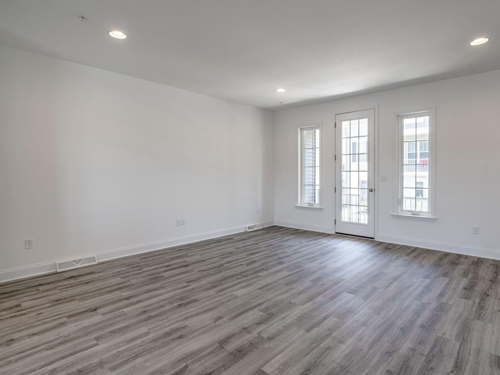 122 Gress Road Cranberry Township, PA 16066 - Photo 15 of 25 a view of an empty room with wooden floor and window