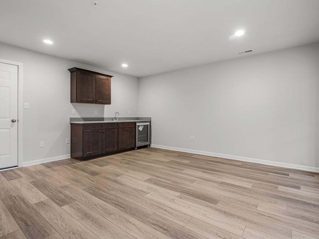 122 Gress Road Cranberry Township, PA 16066 - Photo 22 of 25 a view of a livingroom with a flat screen tv and cabinet