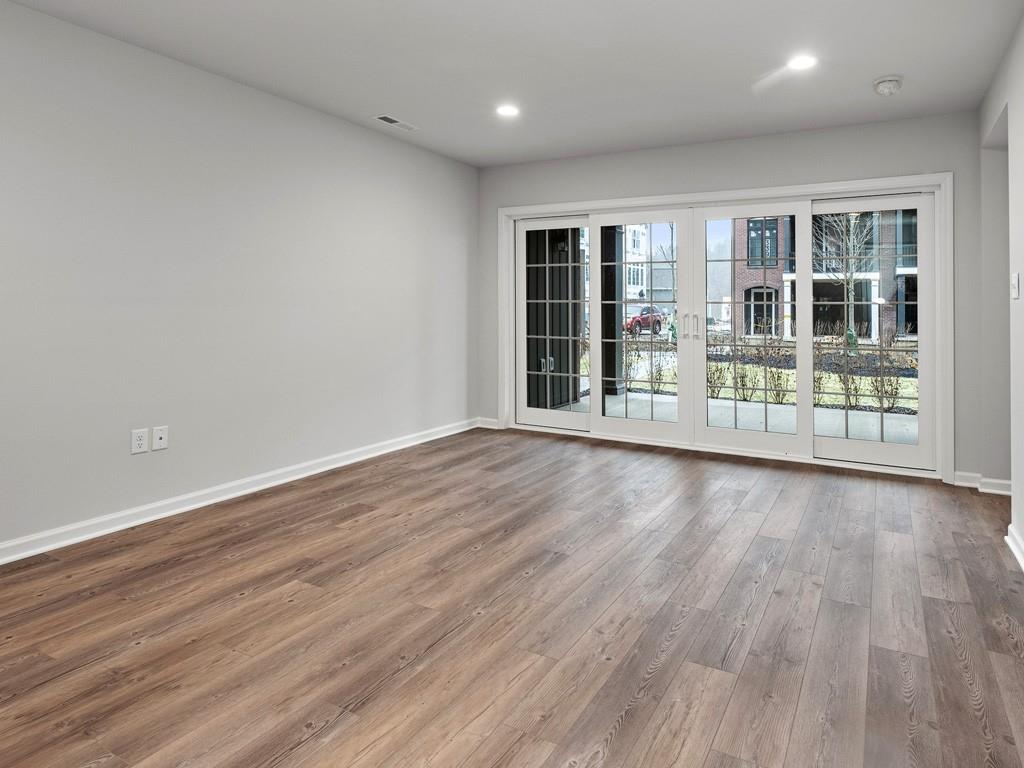 122 Gress Road Cranberry Township, PA 16066 - Photo 23 of 25 a view of an empty room with wooden floor and a window