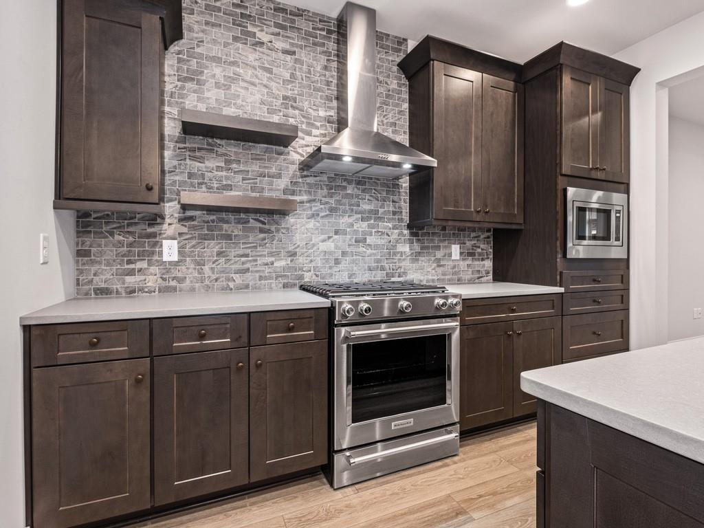 122 Gress Road Cranberry Township, PA 16066 - Photo 8 of 25 a kitchen with stainless steel appliances granite countertop wooden cabinets stove top oven and sink