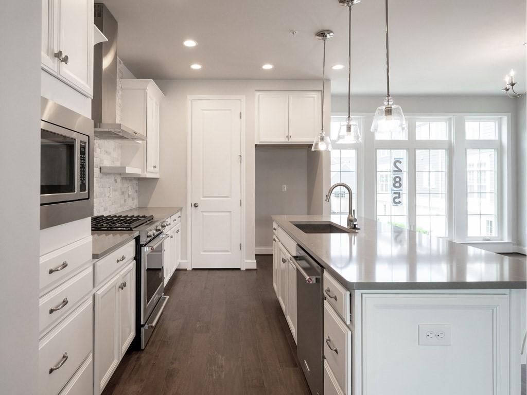 122 Gress Road Cranberry Township, PA 16066 - Photo 10 of 25 a kitchen with stainless steel appliances granite countertop a stove a sink and a refrigerator