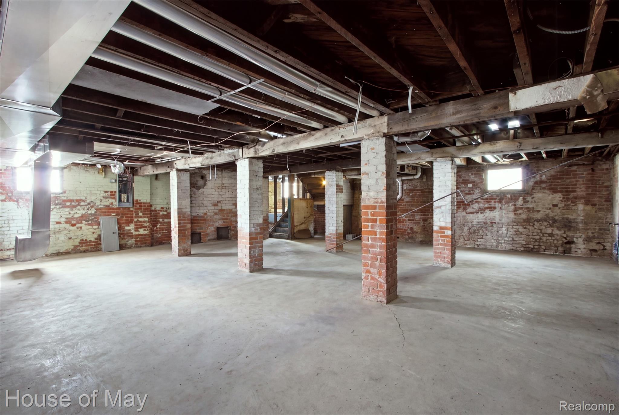 676 Atkinson Street Detroit, MI 48202 - Photo 17 of 17 Unfinished lower level with exposed brick and concrete flooring