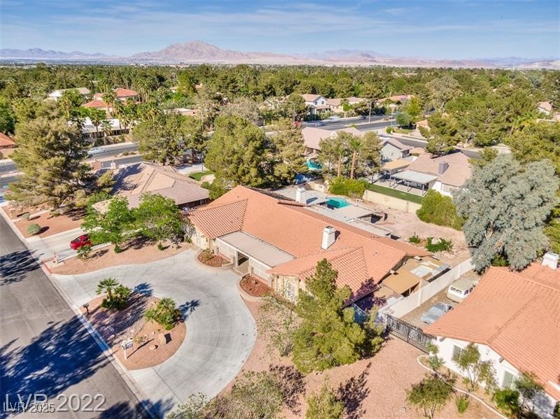 2249 Darwin Circle Henderson, NV 89014 - Photo 4 of 24 Aerial perspective of suburban area with a mountain backdrop