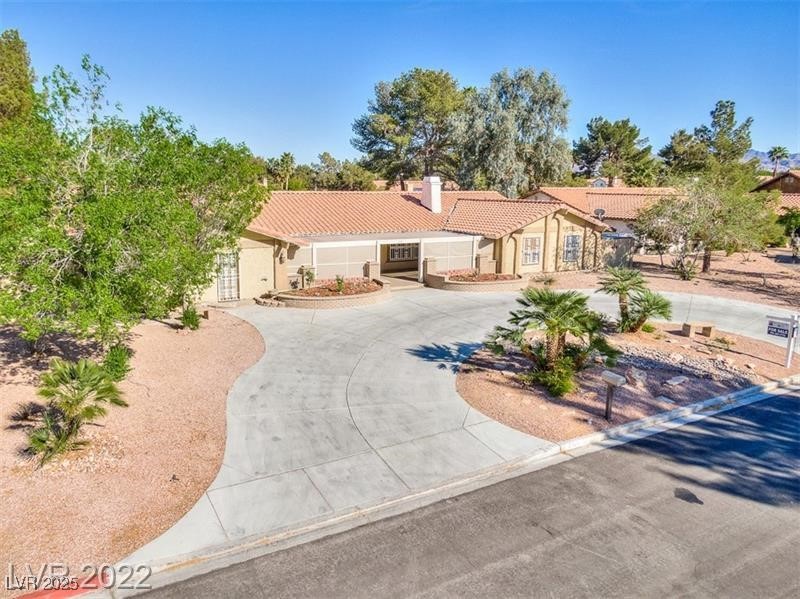 2249 Darwin Circle Henderson, NV 89014 - Photo 5 of 24 View of front of house with a tiled roof, curved driveway, and stucco siding