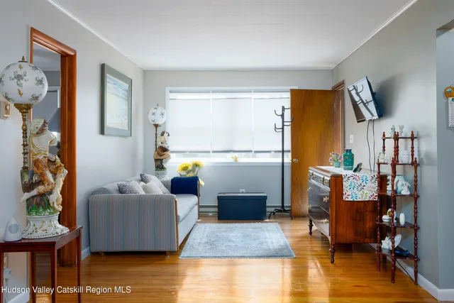 a living room with furniture and a table