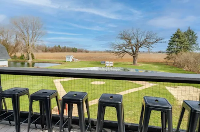 a view of a patio with a table and chairs