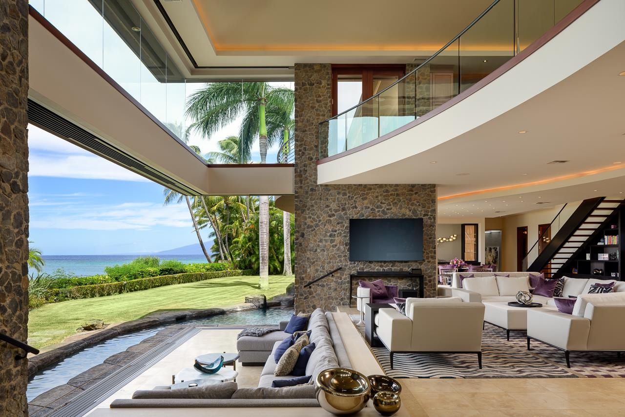 4809 Lower Honoapiilani Road Lahaina, HI 96761 - Photo 5 of 49 a living room with patio furniture and a fireplace