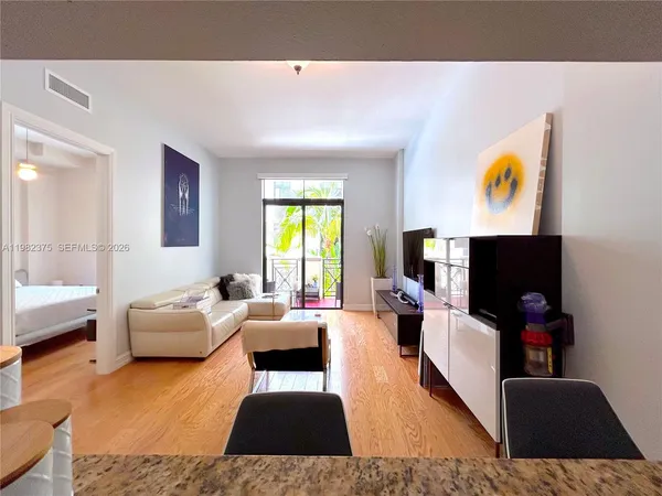 a living room with furniture and window