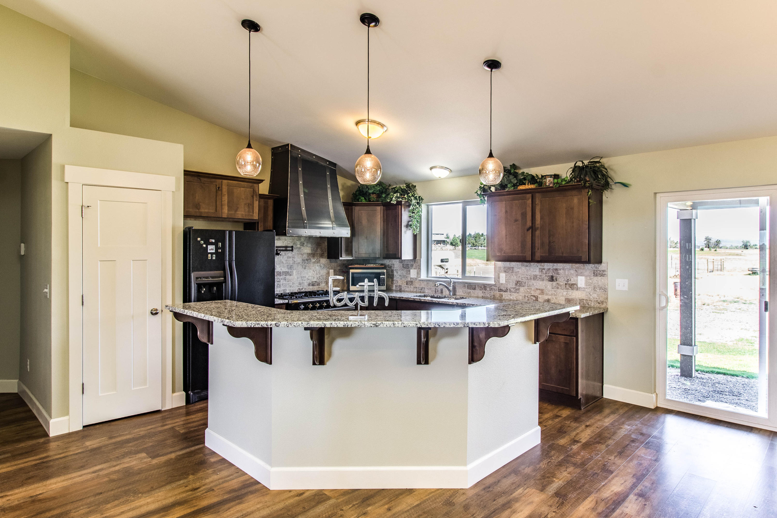 15145 Twin Lakes Road Powell Butte, OR 97753 - Photo 13 of 26 Updated kitchen, granite counter tops, french range, custom range vent, pantry