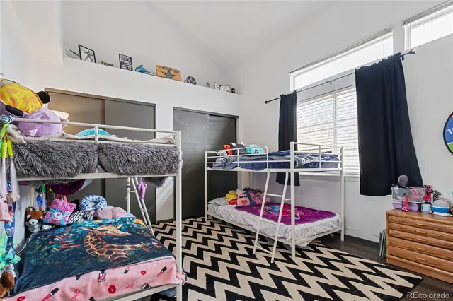 a bedroom with furniture and a baby crib