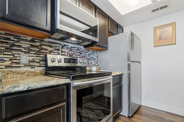 a kitchen with sink and cabinets