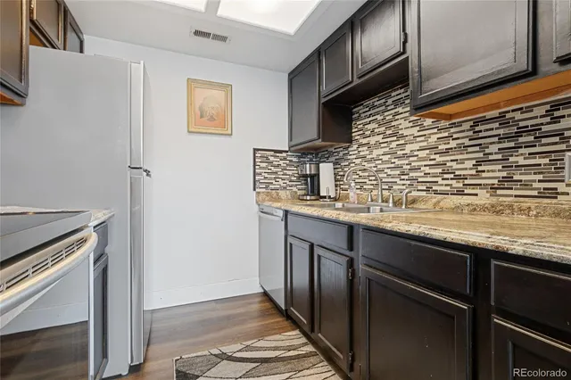 a bedroom with a bed and a mirror