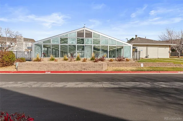 a front view of a house with a road