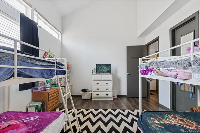 a bedroom with furniture and a window