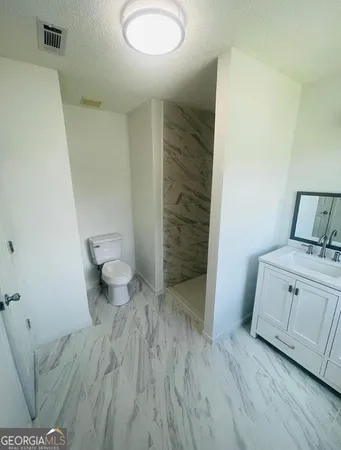a bathroom with a sink and a toilet