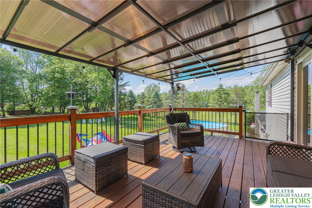 341 Lower Greenhill Road Kunkletown, PA 18058 - Photo 44 of 69 An inviting deck offers abundant space for outdoor lounging and enjoying nature's beauty.