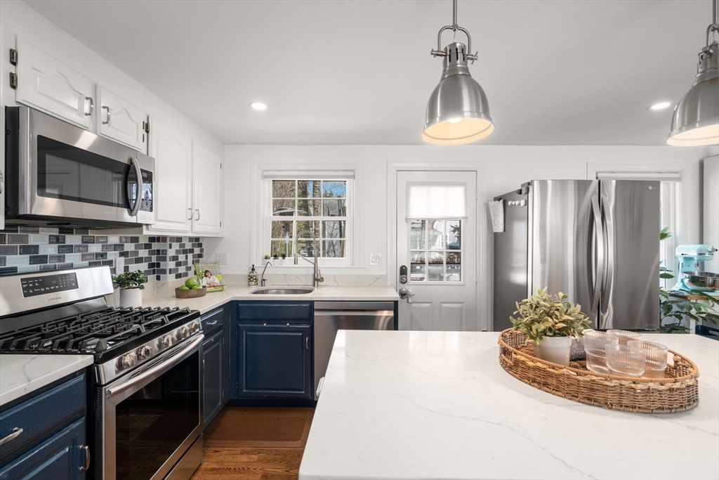 339 Weston Road Wellesley, MA 02481 - Photo 13 of 32 a kitchen with stainless steel appliances a stove sink and microwave