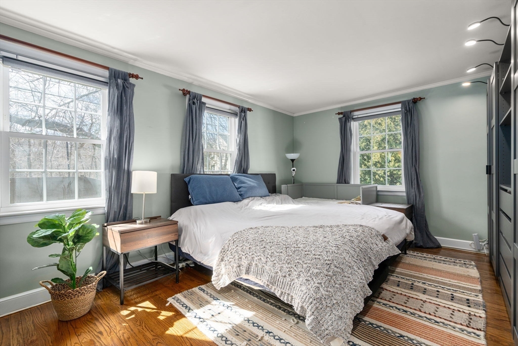 339 Weston Road Wellesley, MA 02481 - Photo 15 of 32 a bedroom with a bed table and a window