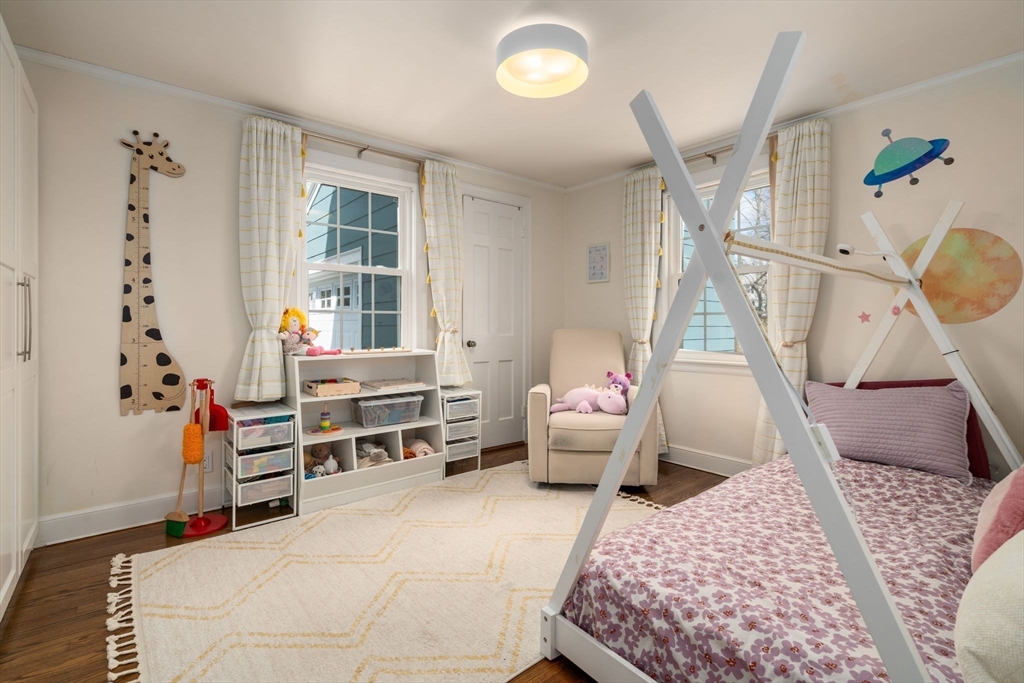 339 Weston Road Wellesley, MA 02481 - Photo 16 of 32 a bedroom with furniture and a wooden floor