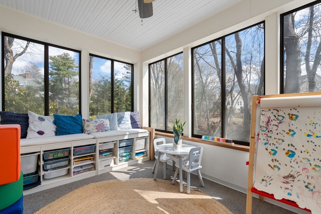 339 Weston Road Wellesley, MA 02481 - Photo 17 of 32 a room with furniture and large windows