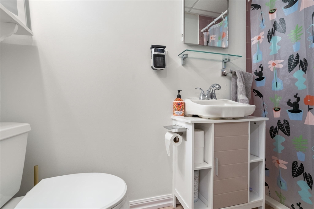 339 Weston Road Wellesley, MA 02481 - Photo 27 of 32 a bathroom with a sink and toilet