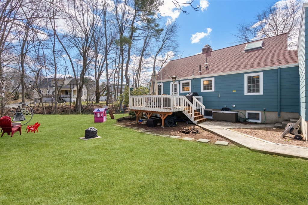 339 Weston Road Wellesley, MA 02481 - Photo 29 of 32 a view of backyard with a table and chairs