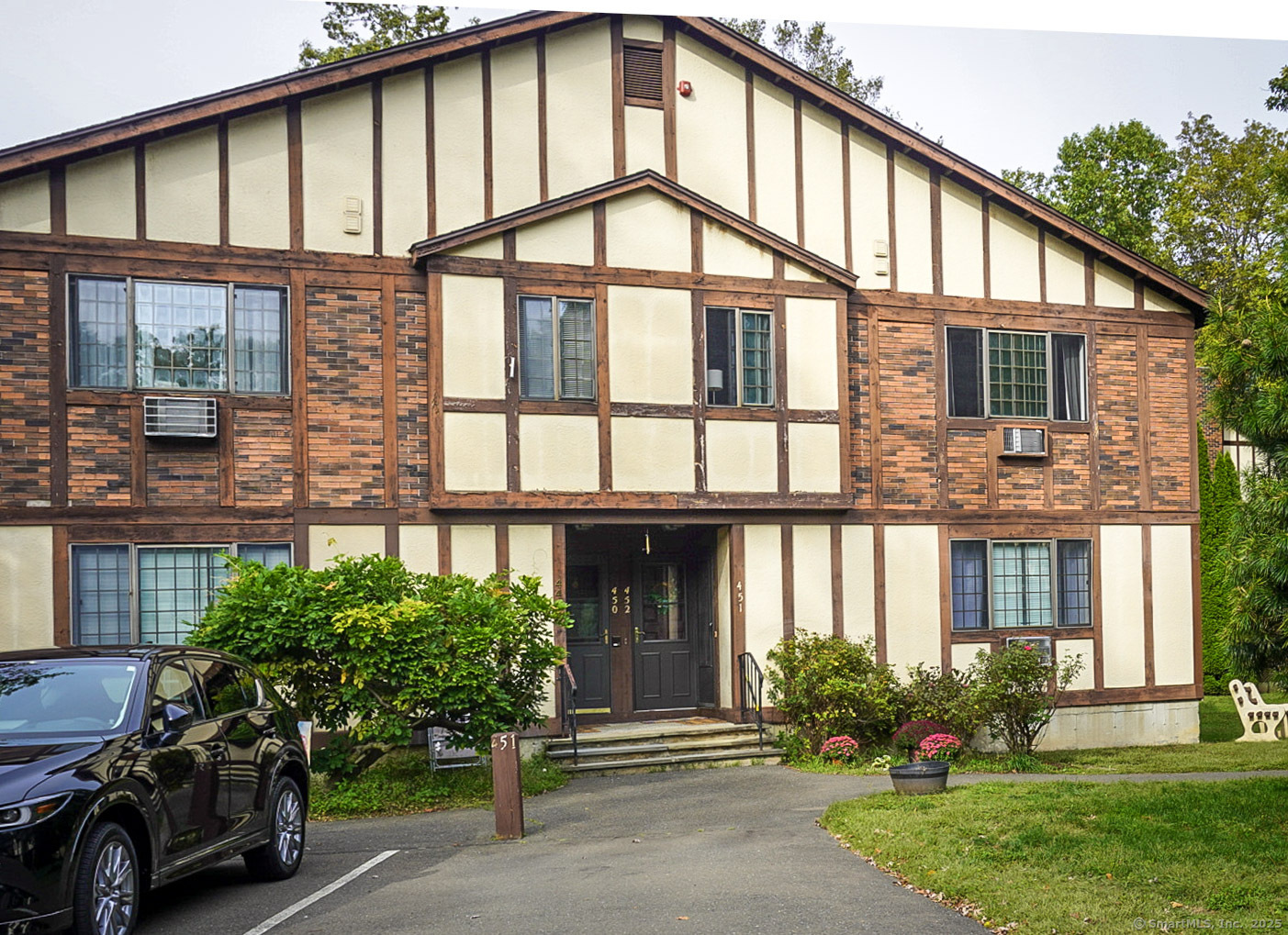 450 Swanson Crescent, Unit 450 Milford, CT 06461 - Photo 1 of 9 a front view of a house with a yard