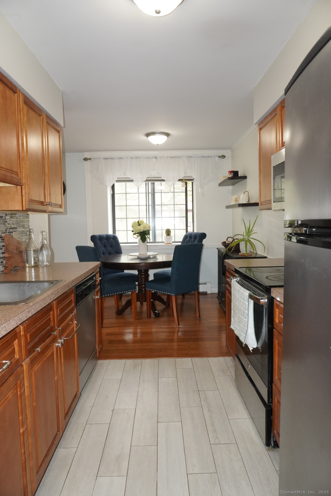 450 Swanson Crescent, Unit 450 Milford, CT 06461 - Photo 6 of 9 a kitchen with granite countertop lots of counter top space