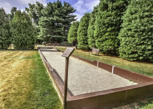 a view of a backyard with chairs