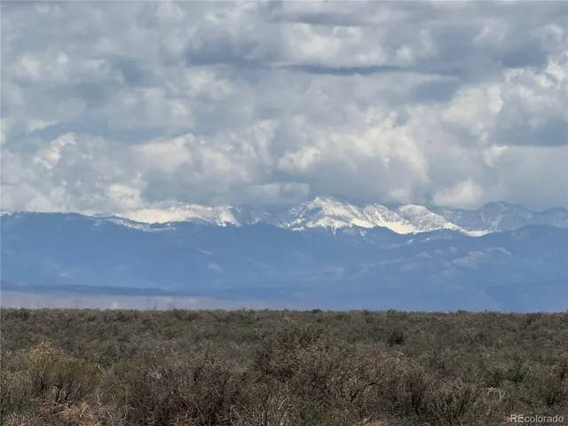 an aerial view of mountain with large trees