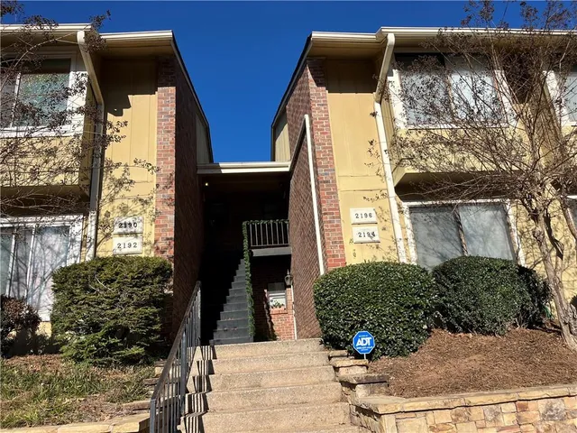 a front view of a house with parking