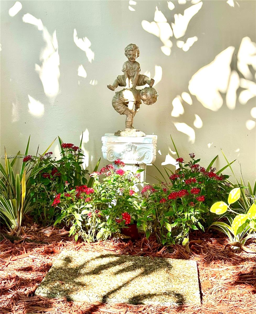 11117 Southwest 122nd Court Miami, FL 33186 - Photo 6 of 29 a vase of flowers sitting on a table