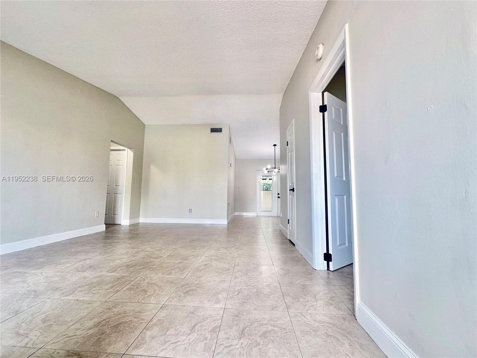 11117 Southwest 122nd Court Miami, FL 33186 - Photo 9 of 29 a view of a big room with closet and windows