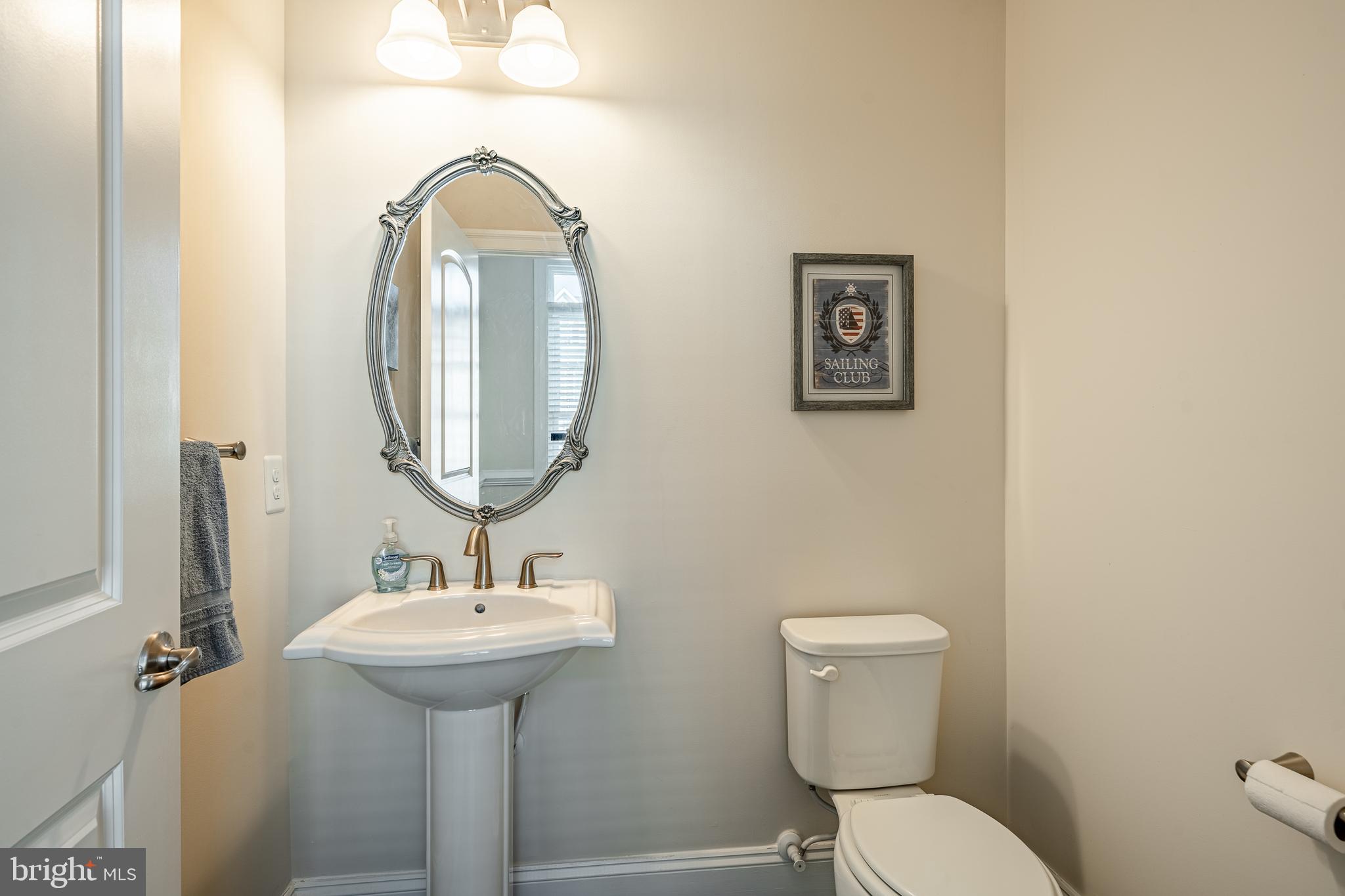 408 Atwater Drive Malvern, PA 19355 - Photo 14 of 49 a bathroom with a toilet sink and mirror