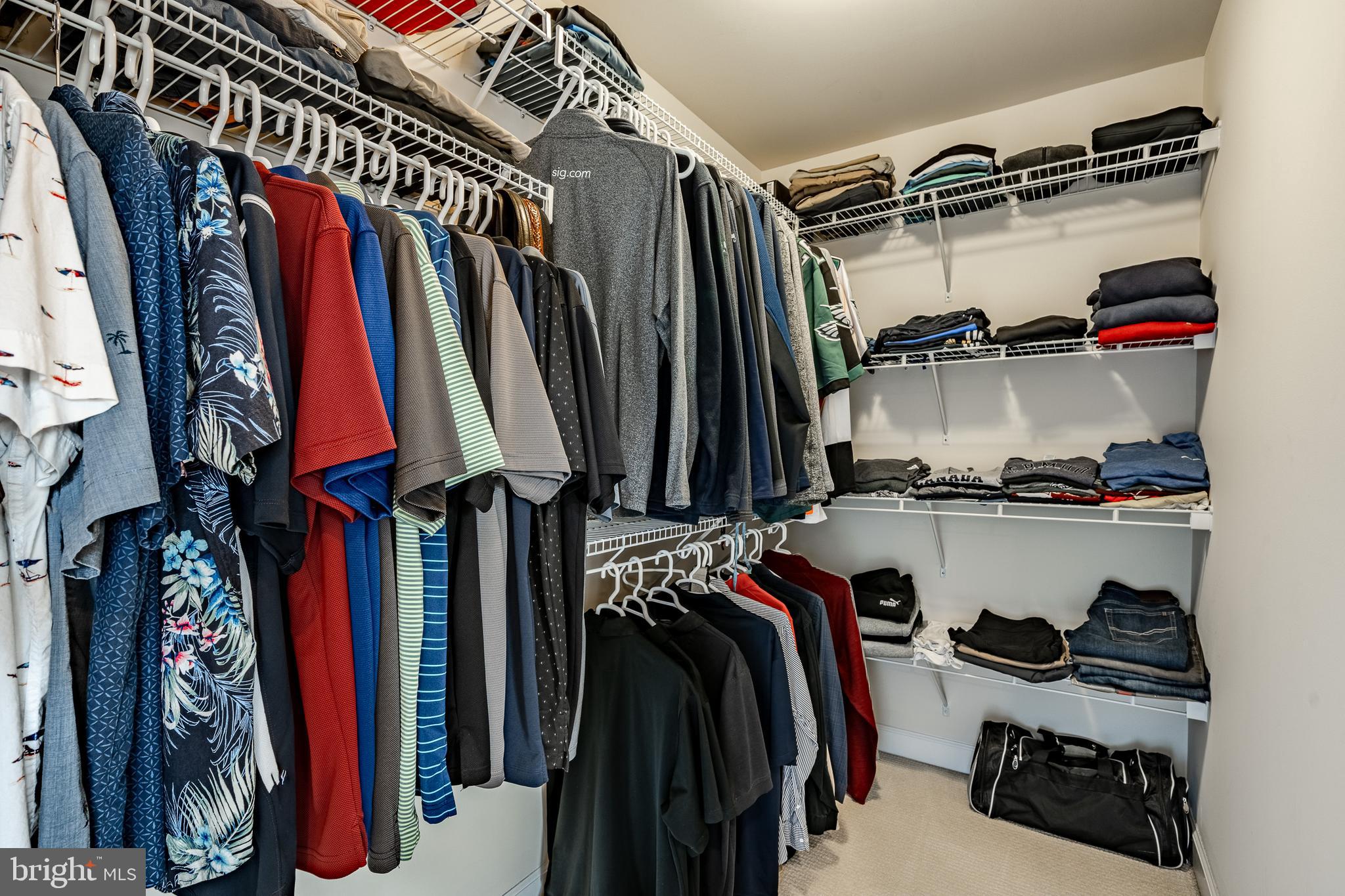 408 Atwater Drive Malvern, PA 19355 - Photo 22 of 49 a view of walk in closet with clothes and shoes