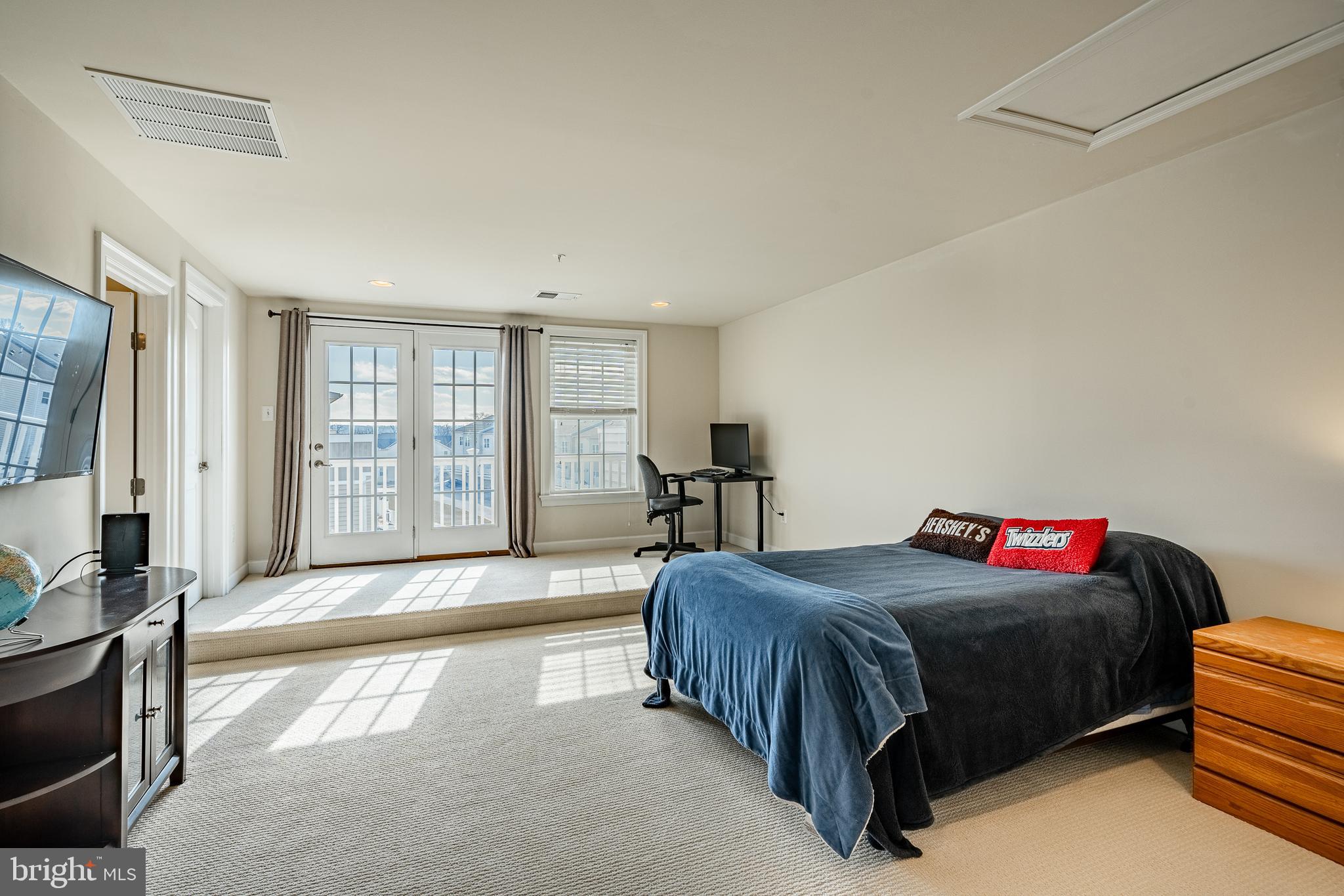 408 Atwater Drive Malvern, PA 19355 - Photo 28 of 49 a bedroom with a bed and a dresser next to a window