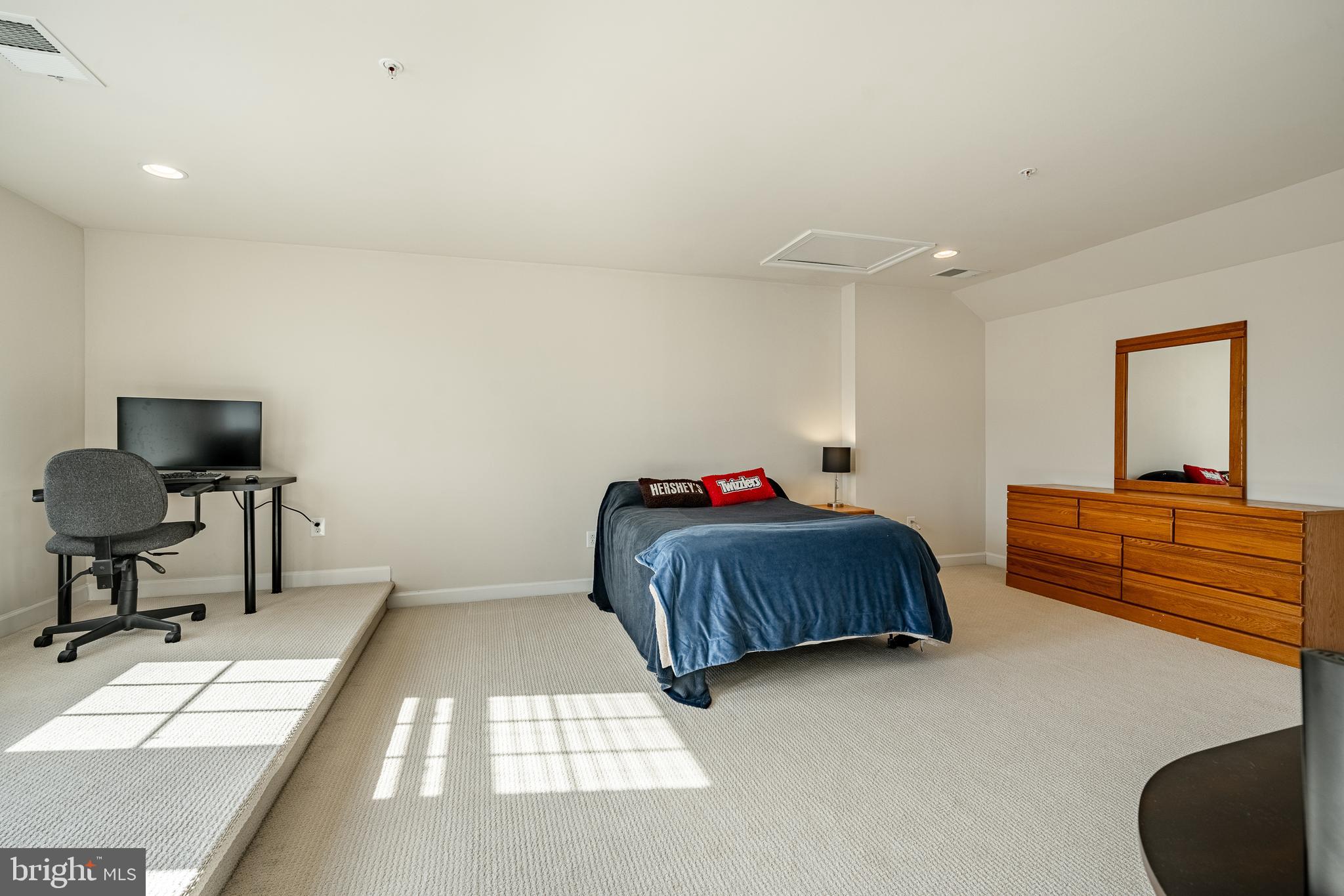 408 Atwater Drive Malvern, PA 19355 - Photo 30 of 49 a bedroom with a bed and a chair